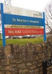 NHS sign at the entrance to St Martin's Hospital.